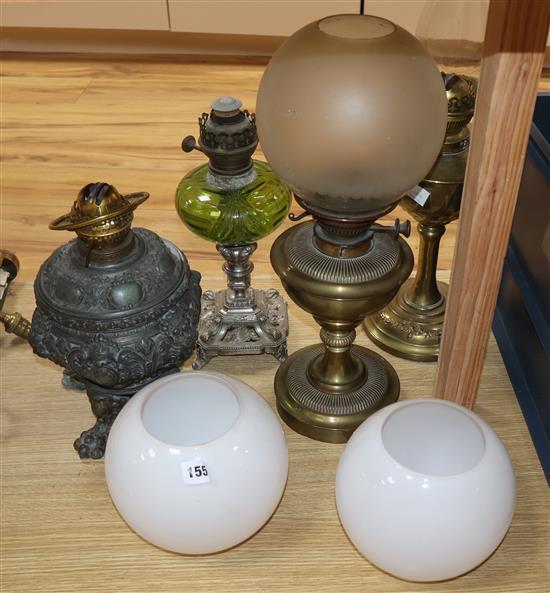 Four various oil lamps
